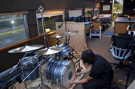 Drum set in a rolling music studio made from an ex-Milwaukee Road cafe car.